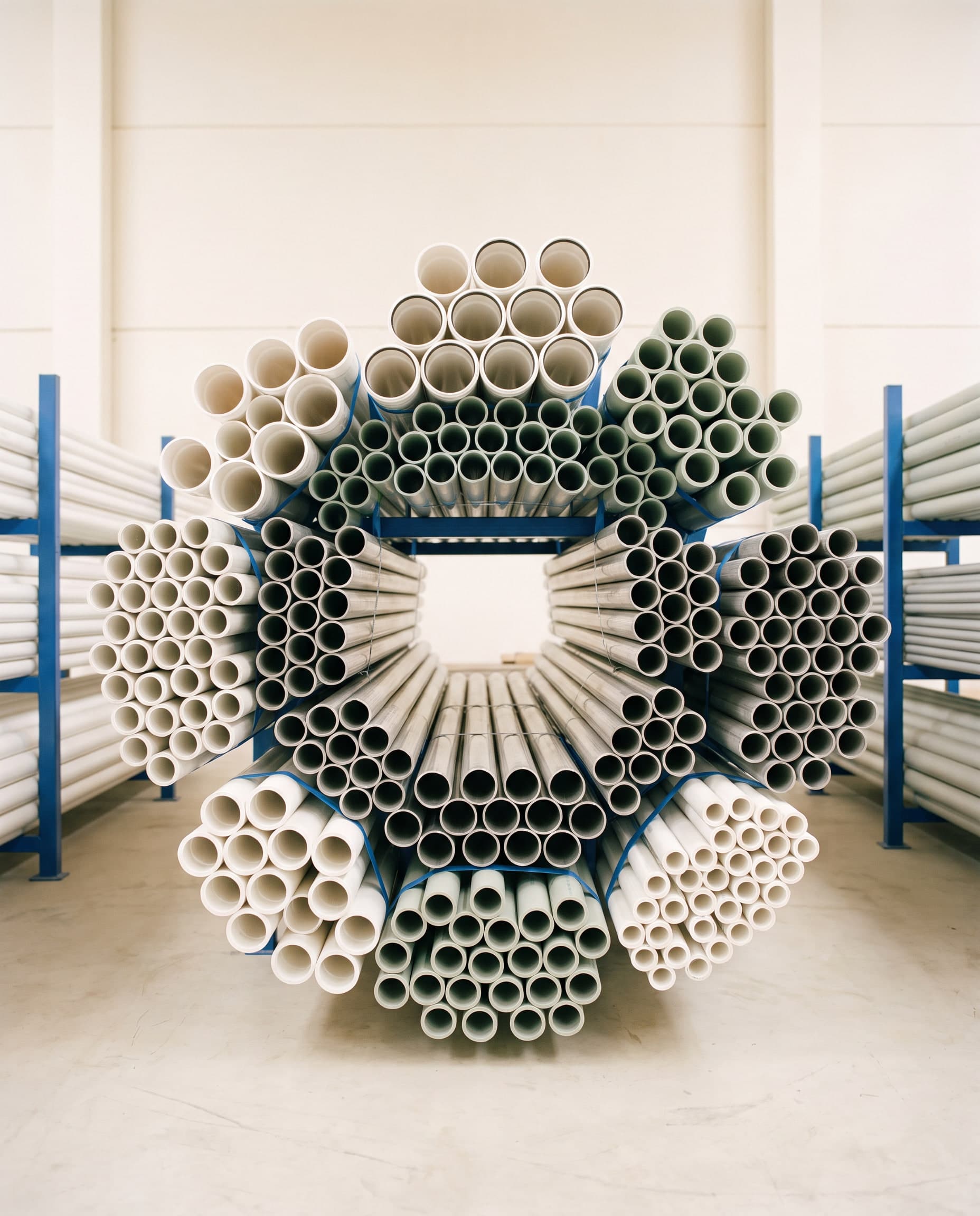 Stacked stainless, PPR and uPVC pipes seen end-on