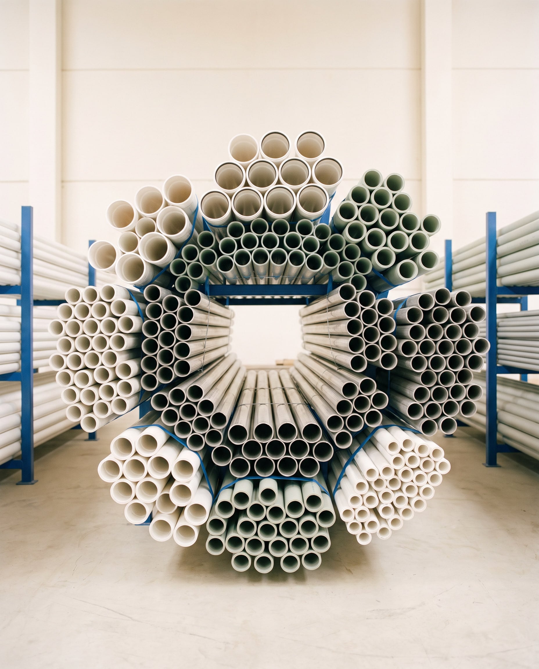 Stacked stainless, PPR and uPVC pipes seen end-on